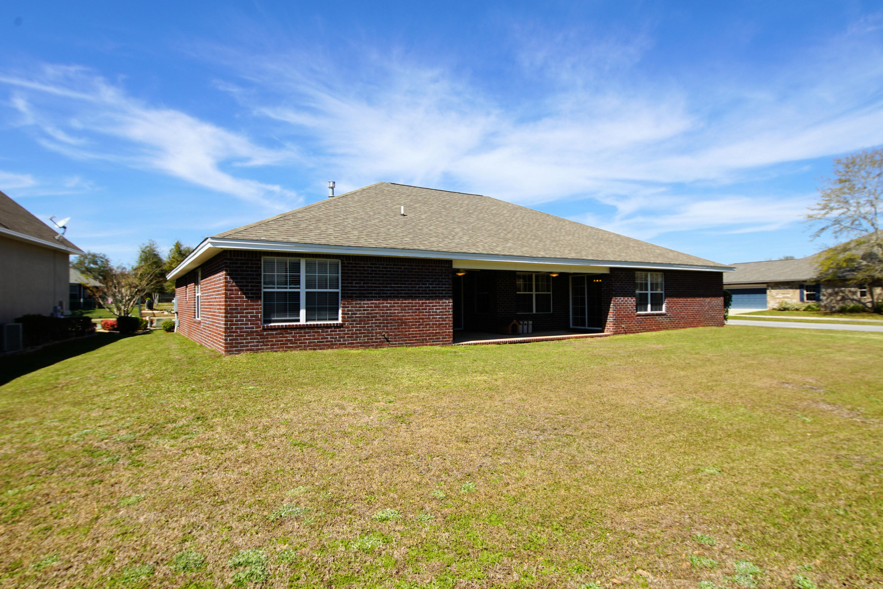 4613 Chanan Drive Crestview, FL 32539 - Photo 39 of 44 a front view of the house with a yard