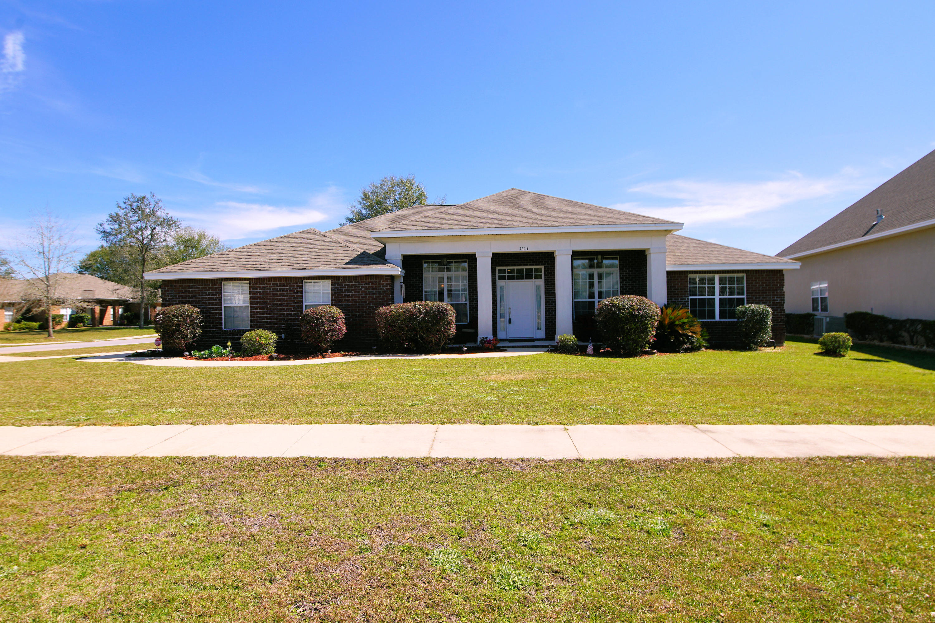 4613 Chanan Drive Crestview, FL 32539 - Photo 42 of 44 a view of a house with a swimming pool