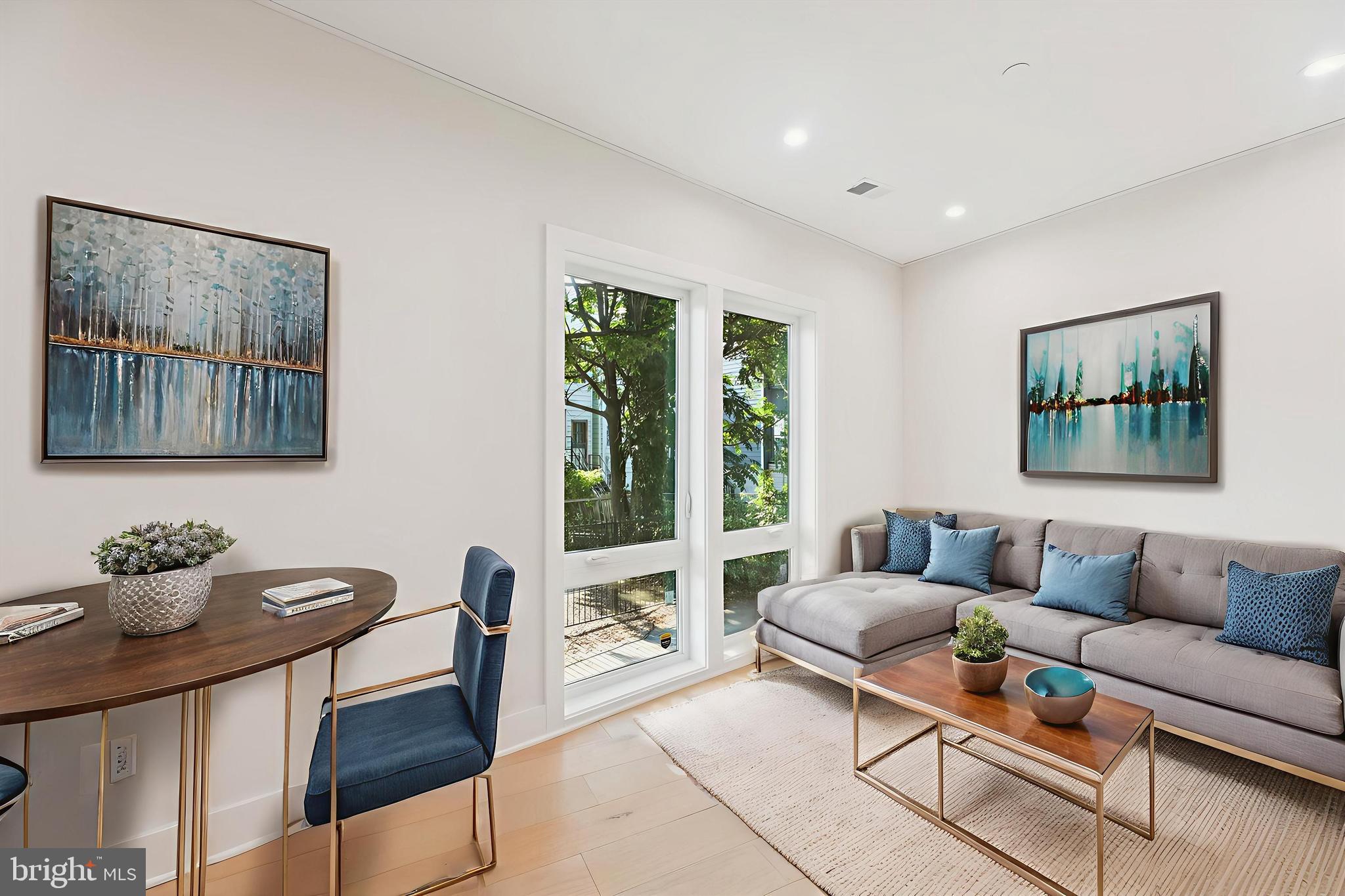 1910 Benning Road Northeast, Unit 2 Washington, DC 20002 - Photo 5 of 19 a living room with furniture and a large window
