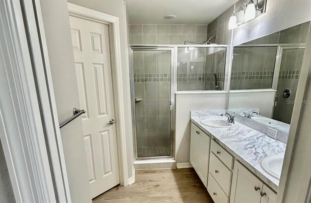 4098 Ruby Run Haines City, FL 33844 - Photo 22 of 34 a bathroom with a granite countertop sink and a mirror