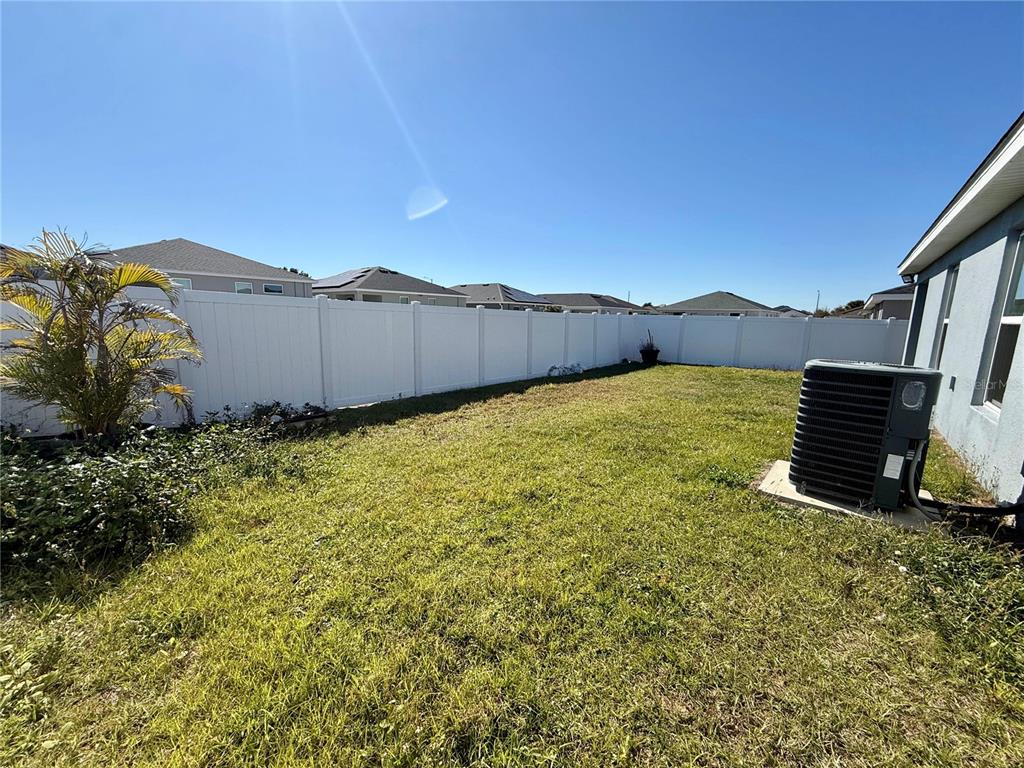 4098 Ruby Run Haines City, FL 33844 - Photo 33 of 34 a view of a large body of water with a building in the background