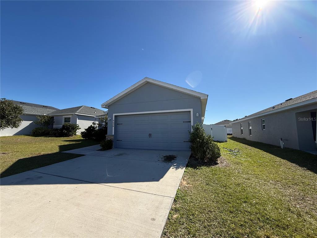 4098 Ruby Run Haines City, FL 33844 - Photo 7 of 34 a house view with a backyard space