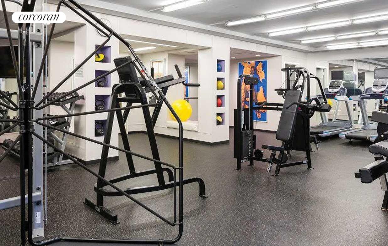 401 East 60th Street, Unit 8F Manhattan, NY 10022 - Photo 11 of 15 a view of a room with gym equipment