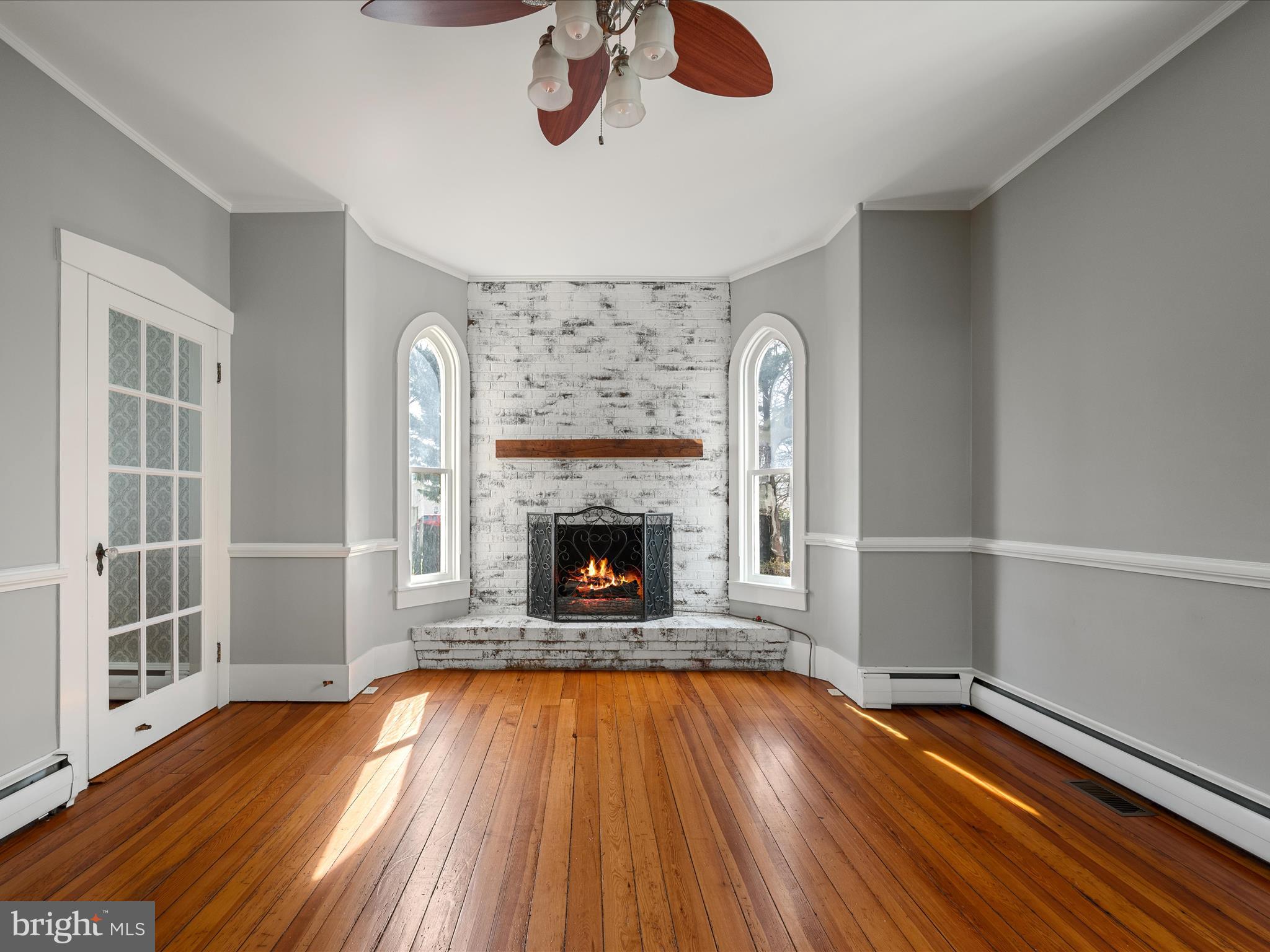 7919 Church Street Middletown, VA 22645 - Photo 7 of 48 a view of empty room with wooden floor and fireplace