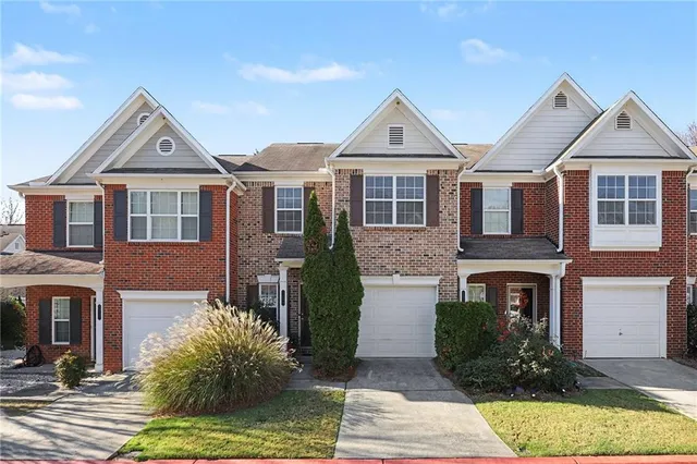 a front view of a house with yard