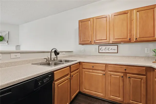 a kitchen with cabinets and sink