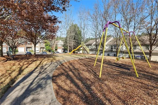 a picture of a bench in front of a building