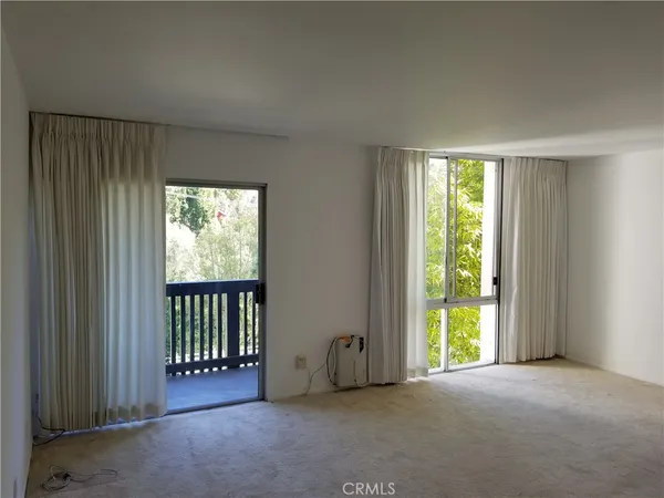 a kitchen with a table and chairs in it