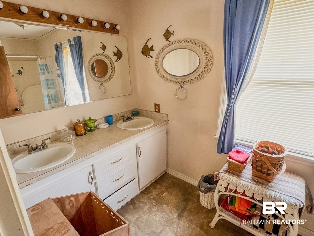 1456 Allen Walker Road Grove Hill, AL 36451 - Photo 24 of 28 Full bath with double vanity and a shower with curtain