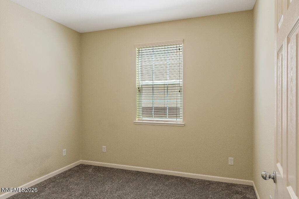 1864 Wind Ranch Road, Unit B Reno, NV 89521 - Photo 28 of 42 an empty room with a window