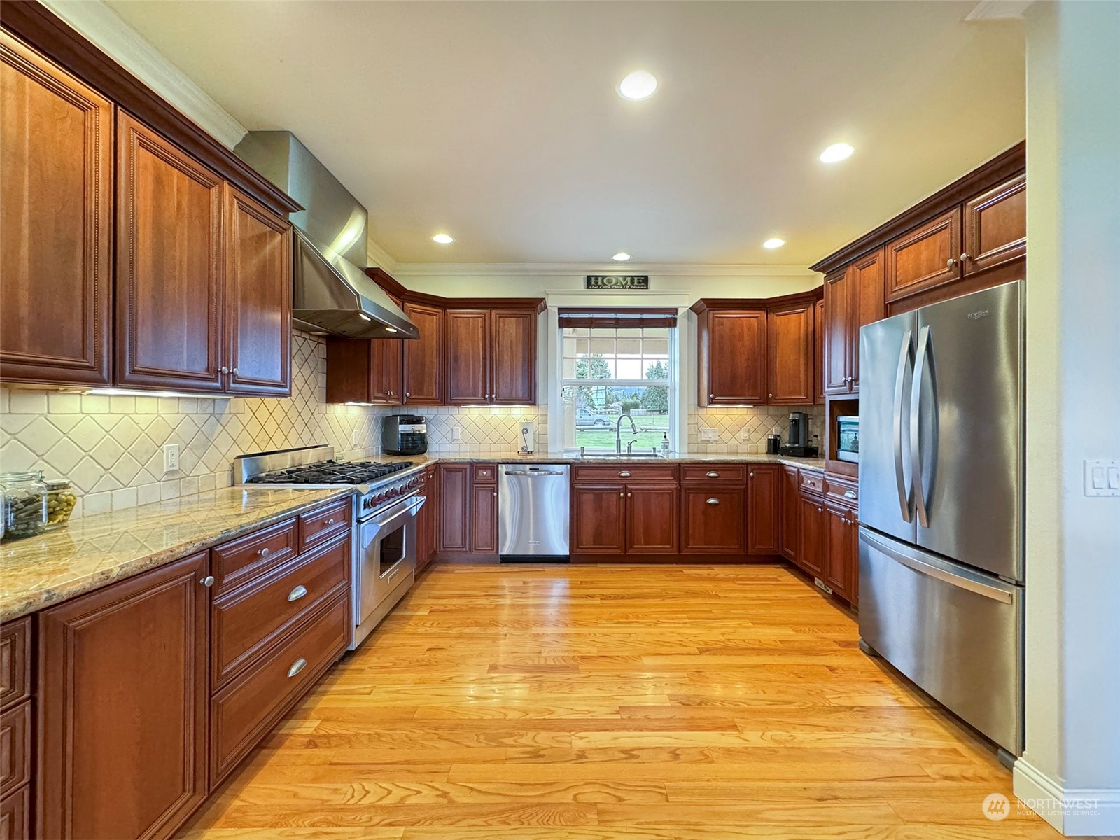 31 Fergy Lane Sequim, WA 98382 - Photo 11 of 40 a large kitchen with stainless steel appliances wooden cabinets a sink and a counter space