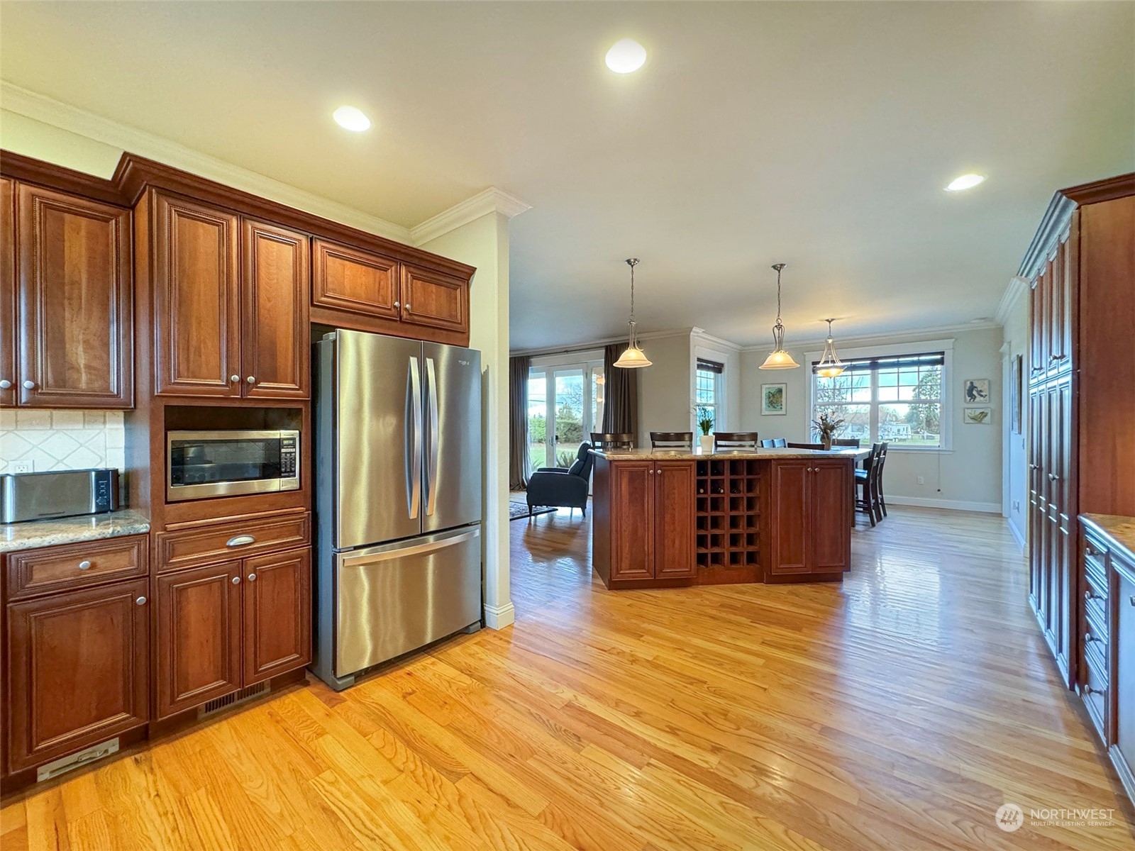 31 Fergy Lane Sequim, WA 98382 - Photo 12 of 40 a large kitchen with kitchen island a large counter top stainless steel appliances and cabinets