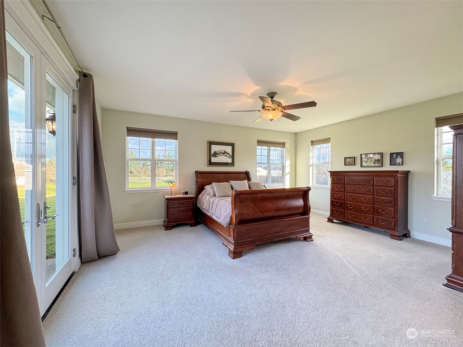 31 Fergy Lane Sequim, WA 98382 - Photo 15 of 40 a bedroom with a bed and a chandelier