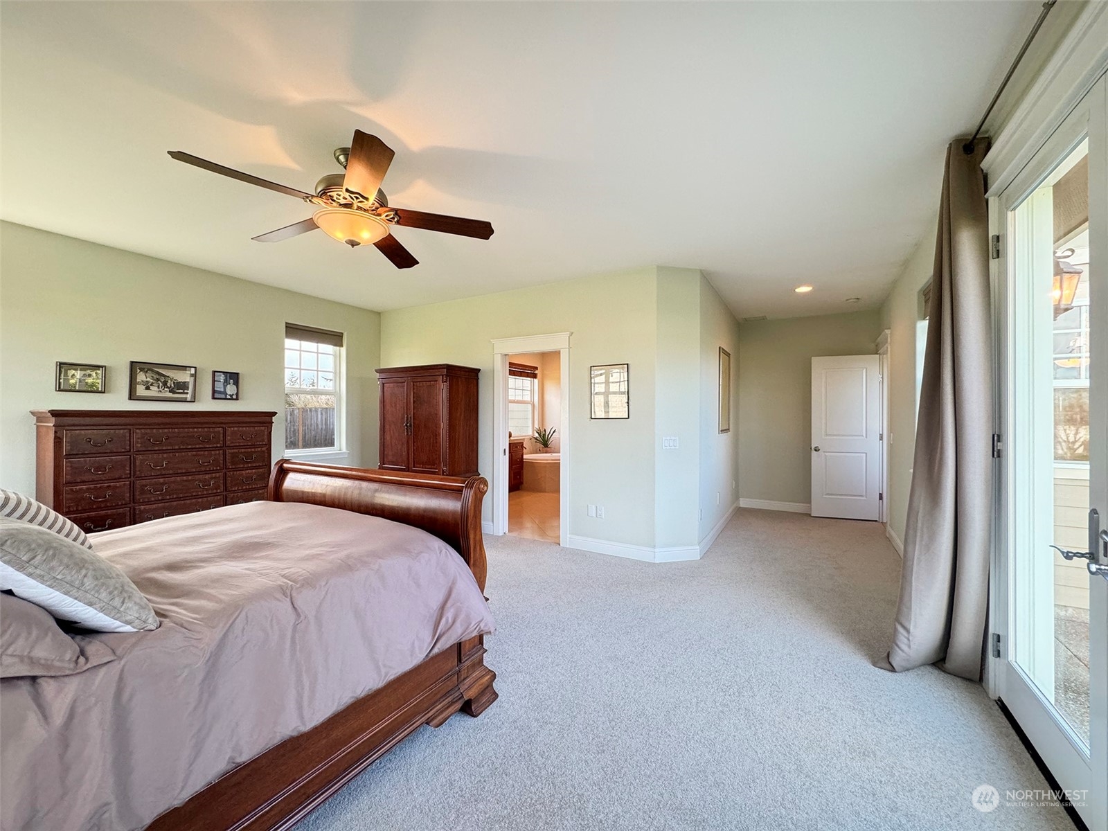 31 Fergy Lane Sequim, WA 98382 - Photo 17 of 40 a bedroom with a bed and a chandelier