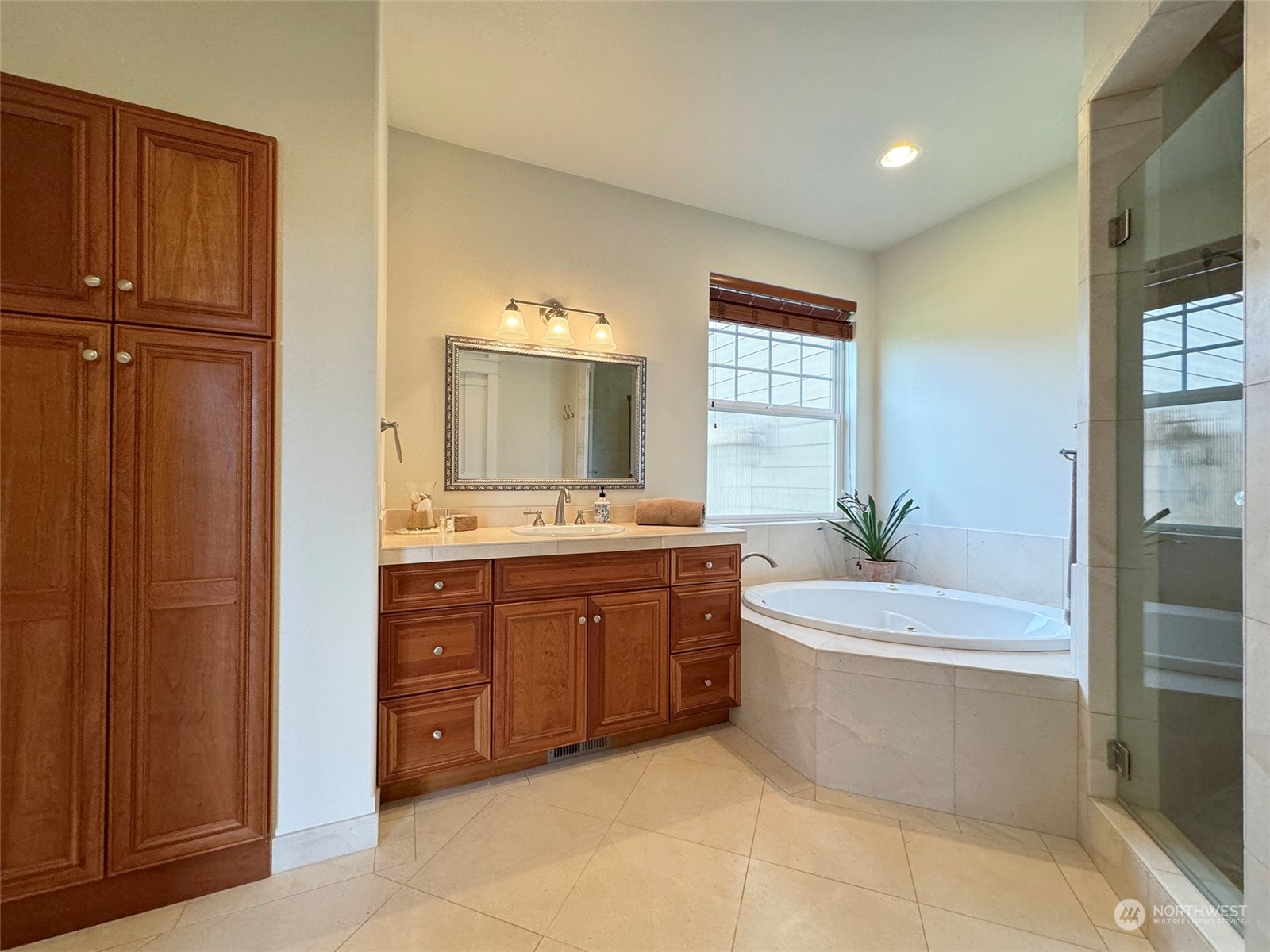 31 Fergy Lane Sequim, WA 98382 - Photo 18 of 40 a spacious bathroom with a tub sink and mirror