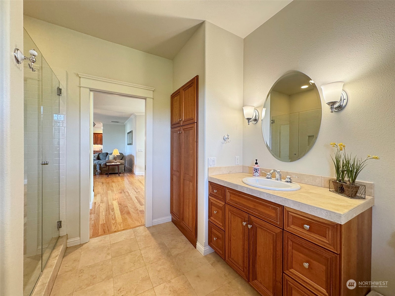 31 Fergy Lane Sequim, WA 98382 - Photo 23 of 40 a en suite bathroom with a double vanity sink and a mirror