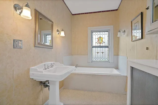 a bathroom with a sink and a bathtub