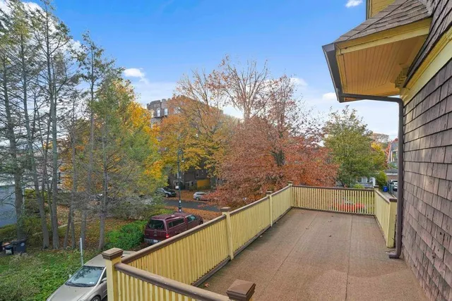 a view of balcony with two trees