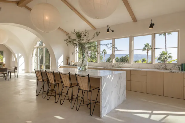 a view of a dining room with furniture window and outside view