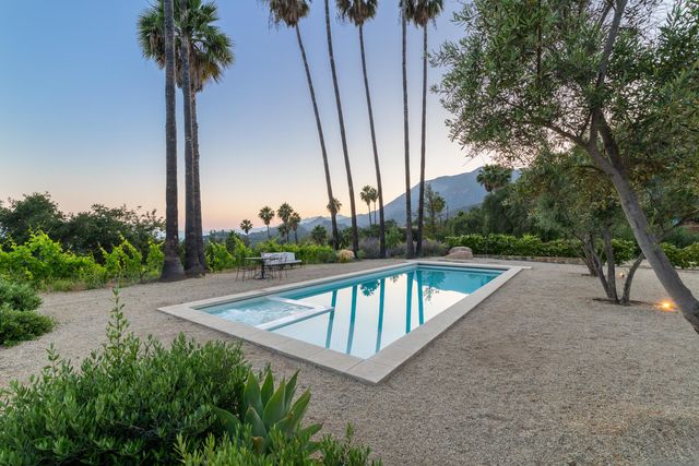 a view of a backyard with a small pool