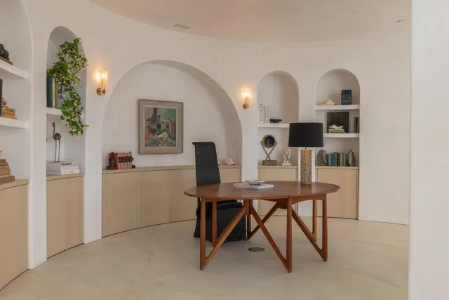 a view of a workspace with furniture