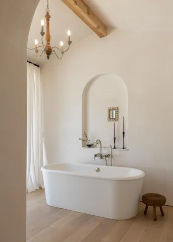 a white bath tub sitting in a bathroom