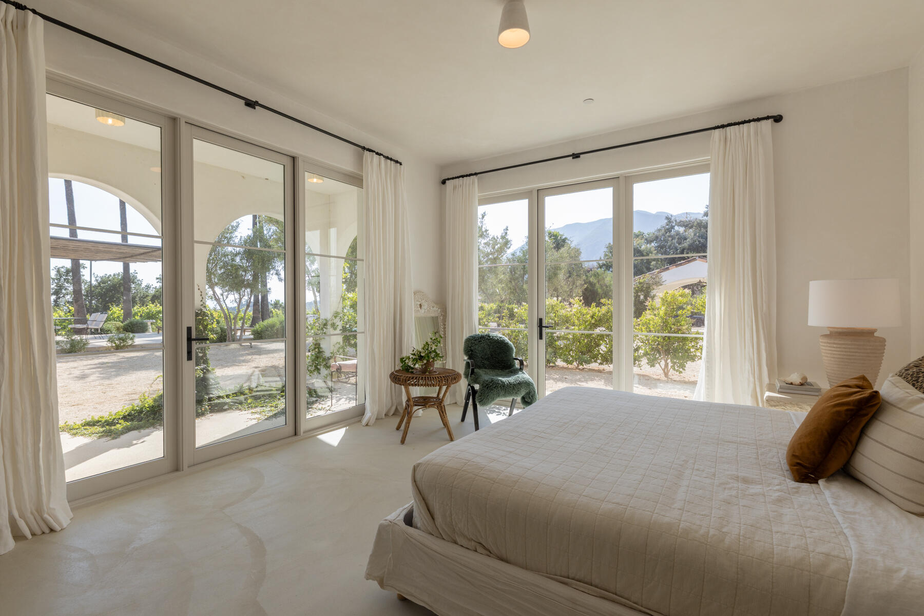 2259 McNell Road Ojai, CA 93023 - Photo 23 of 39 a bedroom with a bed and large windows