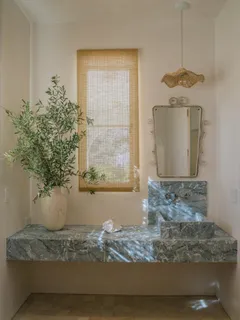 a white bath tub sitting in a bathroom