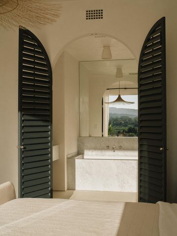 a view of a living room and bathroom