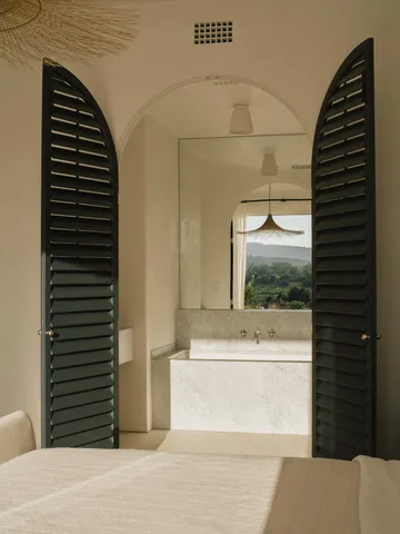 a view of a living room and bathroom