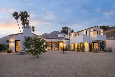 a view of a house with a street