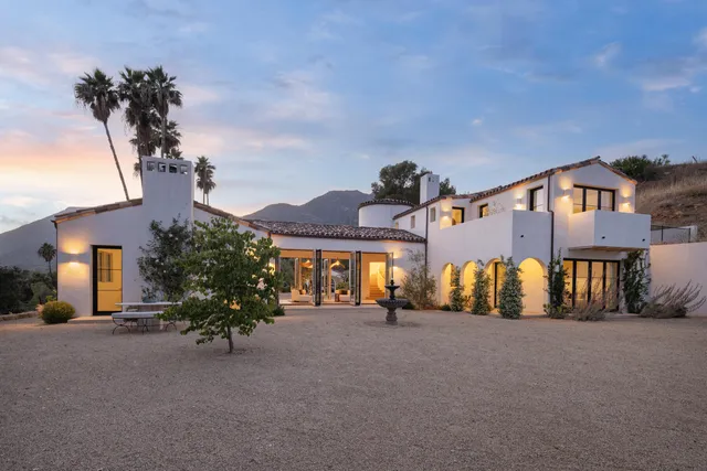 a view of a house with a street