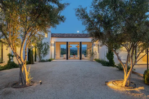 a front view of a house with a yard