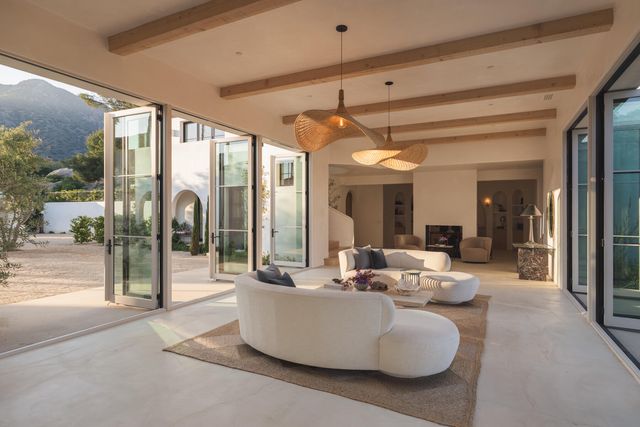 a living room with couch and a large window