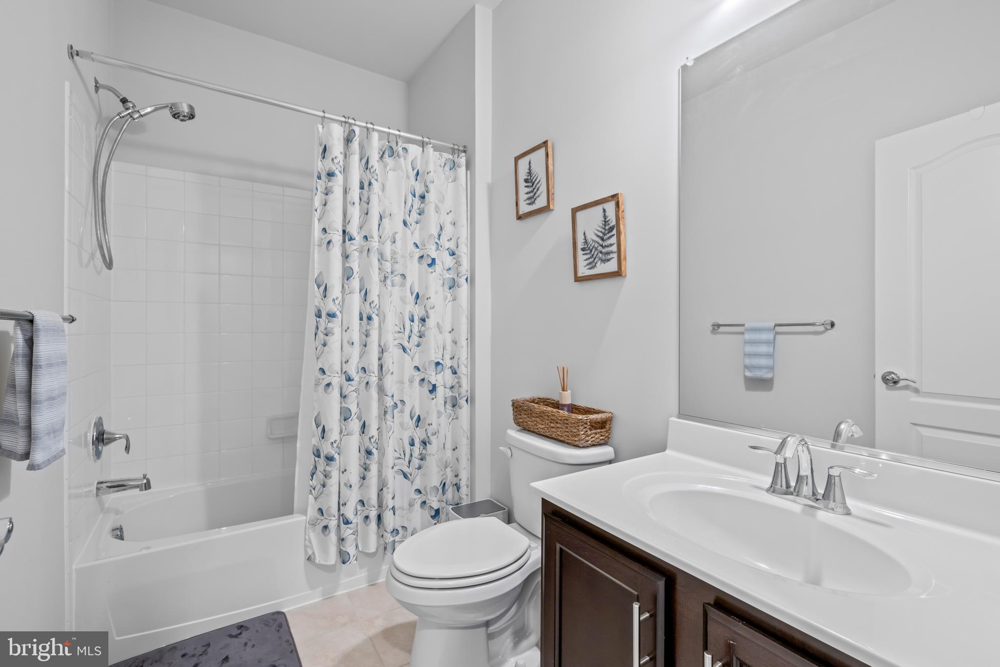 7715 Cresap Lane Hanover, MD 21076 - Photo 26 of 42 a bathroom with a sink toilet and shower