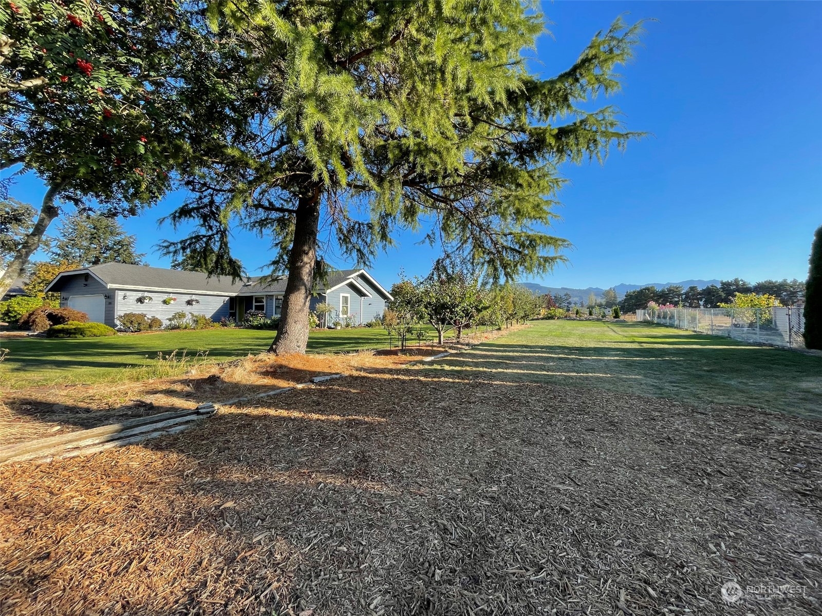 806 North Kendall Road Sequim, WA 98382 - Photo 34 of 40 a view of a house with a yard