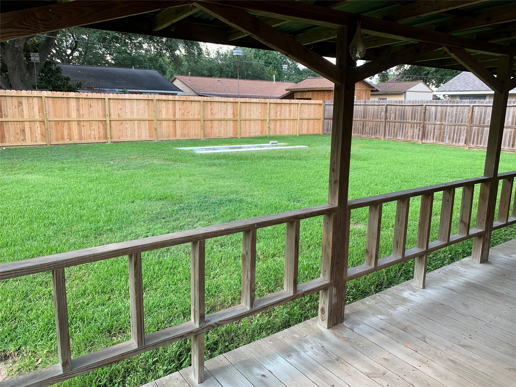 1110 East Rutgers Lane Deer Park, TX 77536 - Photo 18 of 19 Large covered back patio and deck. Plenty of room for patio furniture.