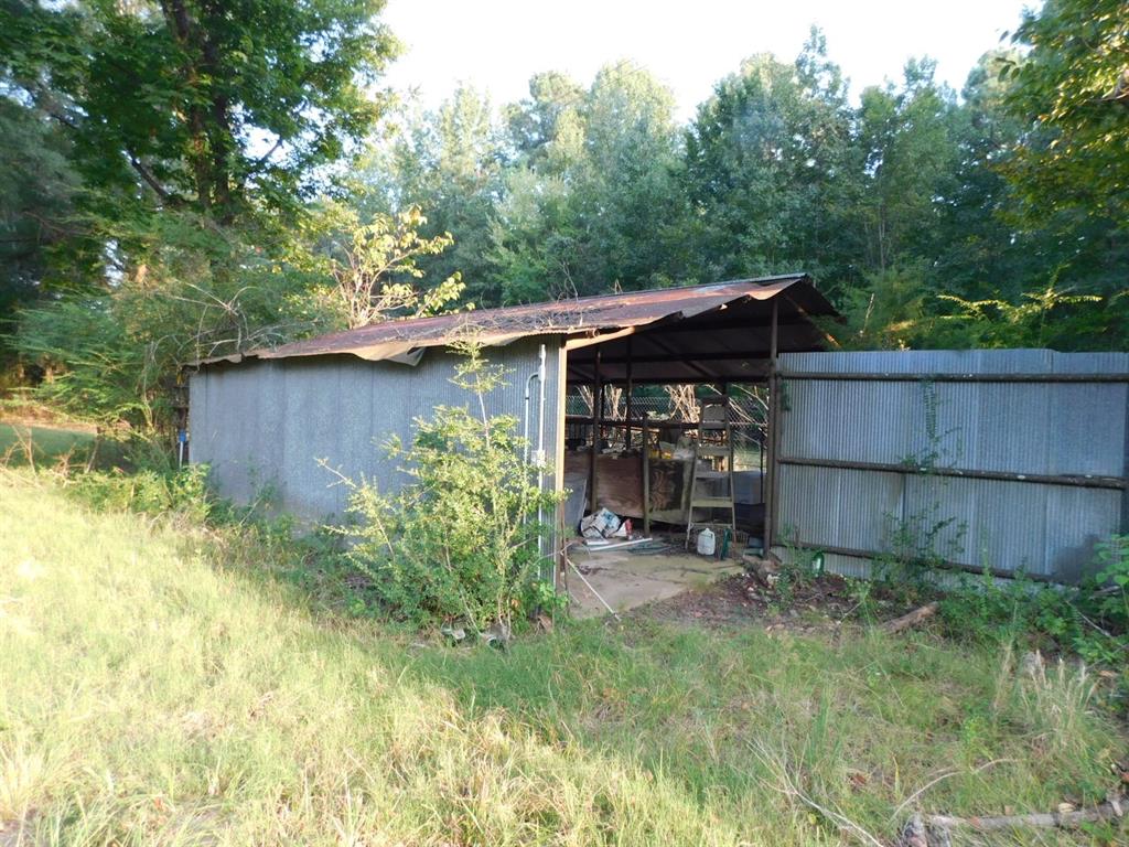 0 Spring Branch Road Springhill, LA 71075 - Photo 17 of 17 a view of a backyard with plants and trees