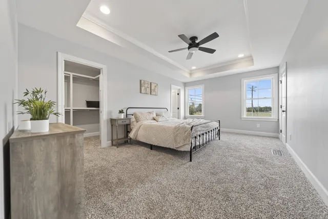 a bathroom with a double vanity sink toilet and shower
