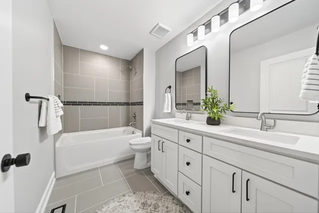 a bathroom with a bathtub and shower