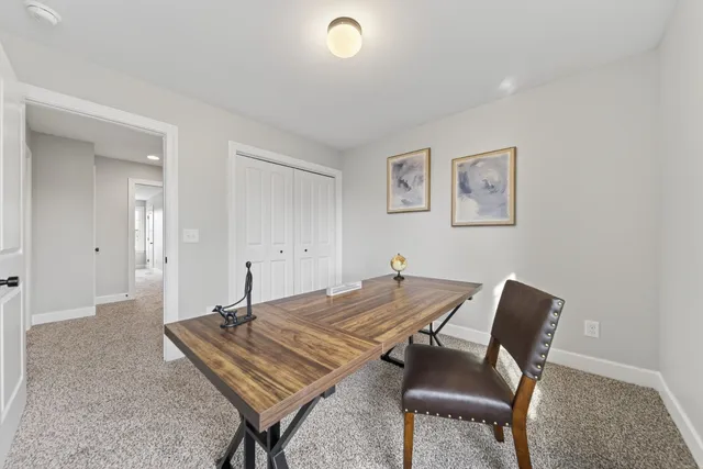 a workspace with furniture and a window