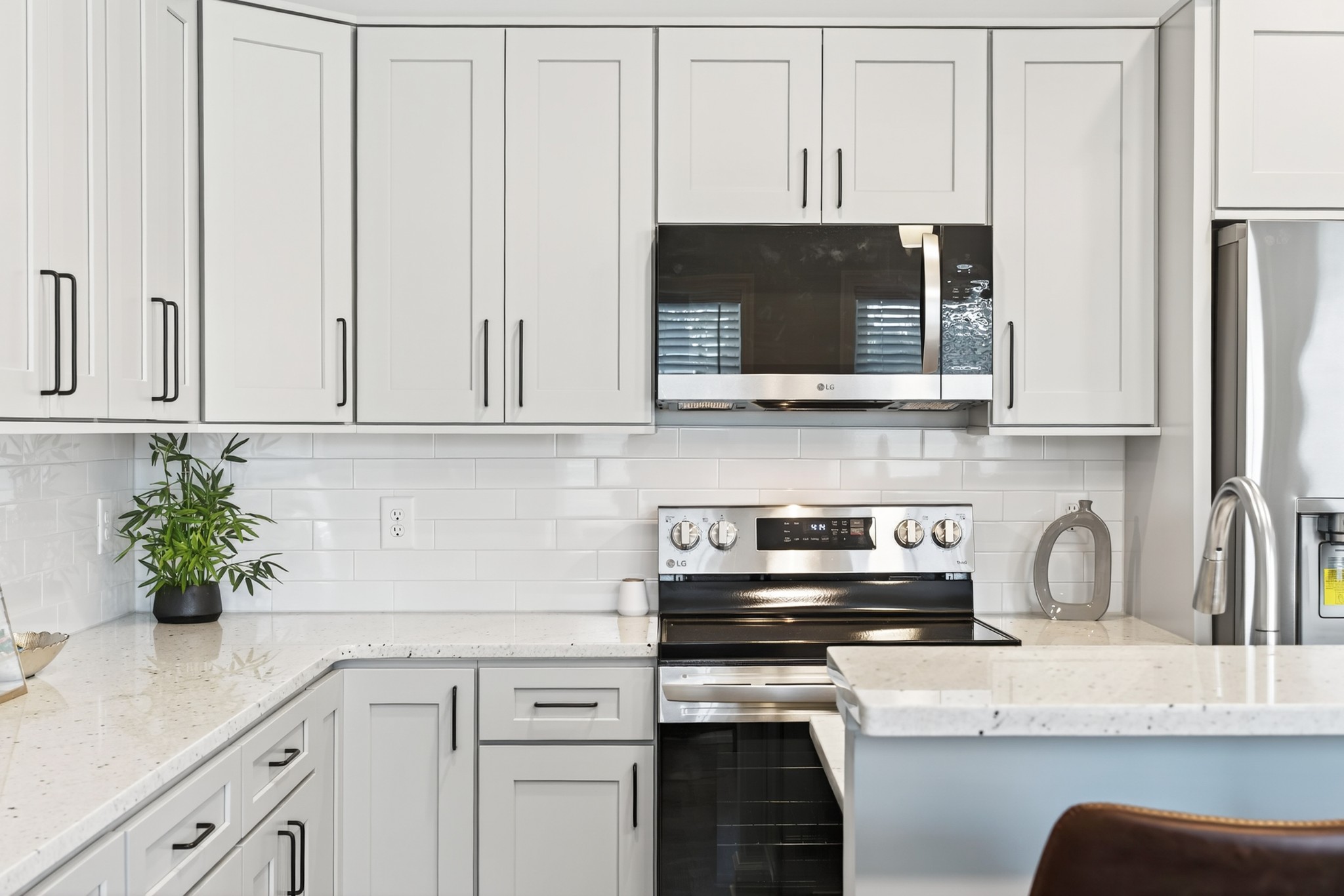 100 Maple View Drive Lebanon, TN 37087 - Photo 7 of 35 a kitchen with stainless steel appliances granite countertop white cabinets a stove top oven a sink and dishwasher