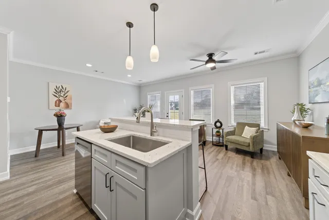 a very nice looking living room with wooden floor