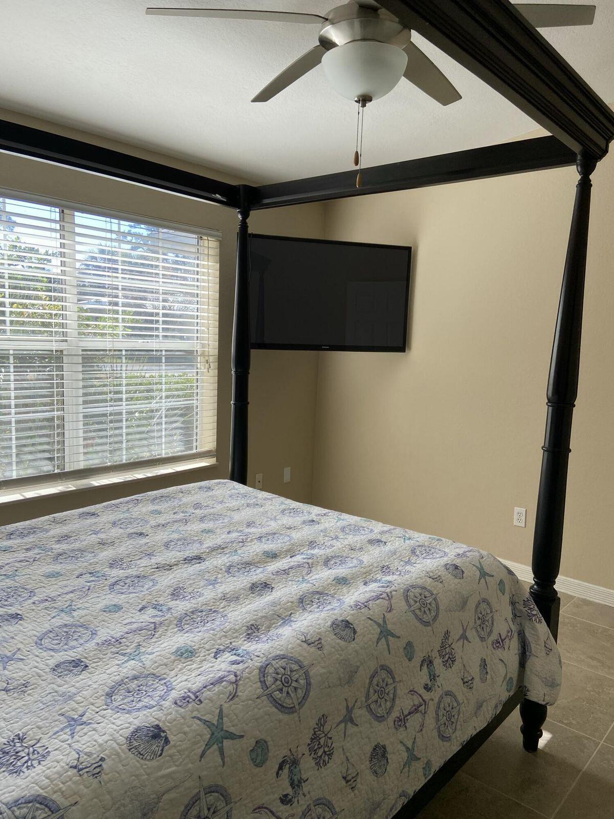 19 Plantation Way Santa Rosa Beach, FL 32459 - Photo 11 of 36 a bedroom with a bed and a large window