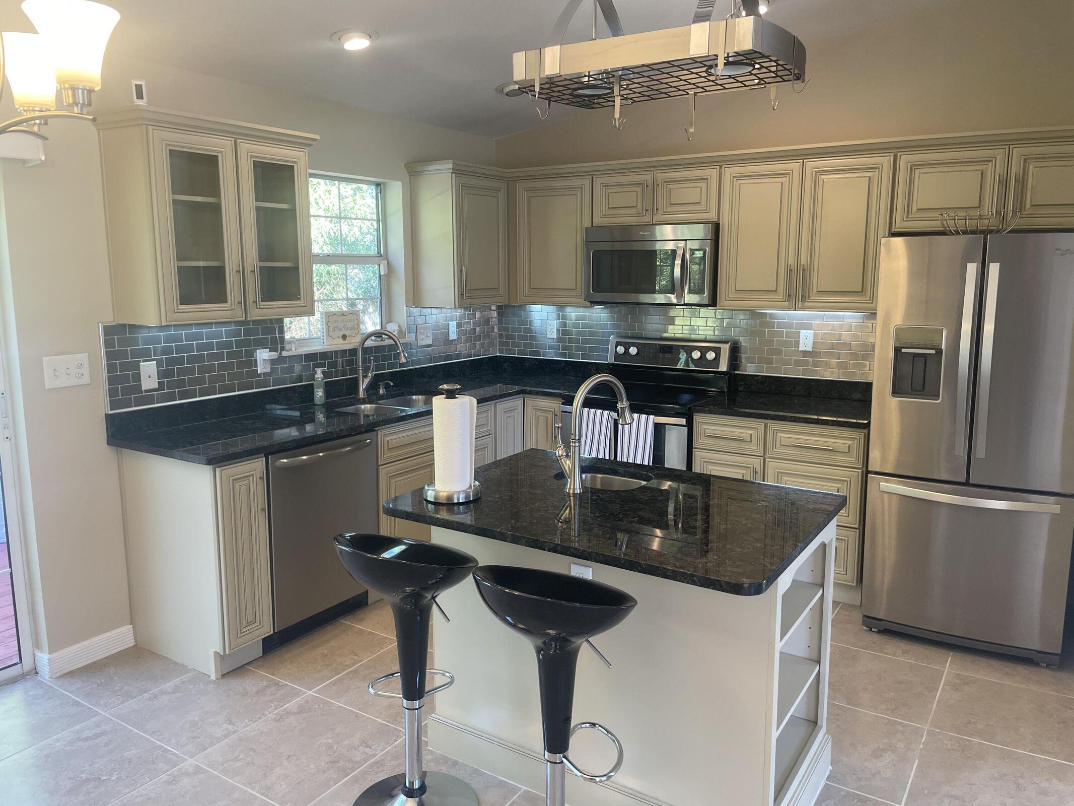 19 Plantation Way Santa Rosa Beach, FL 32459 - Photo 2 of 36 a kitchen with a counter space a sink and appliances