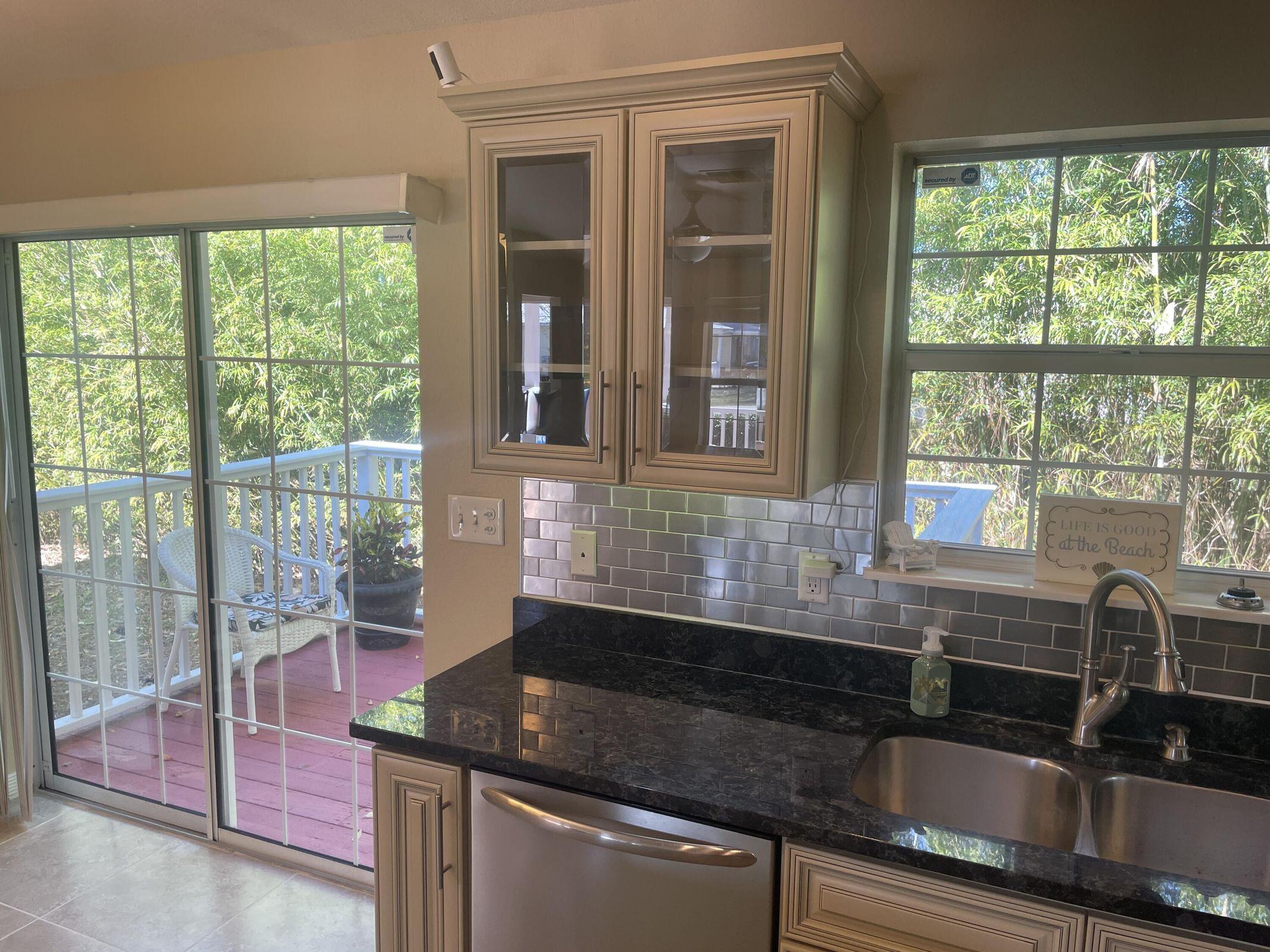 19 Plantation Way Santa Rosa Beach, FL 32459 - Photo 21 of 36 a kitchen with granite countertop a sink and a window