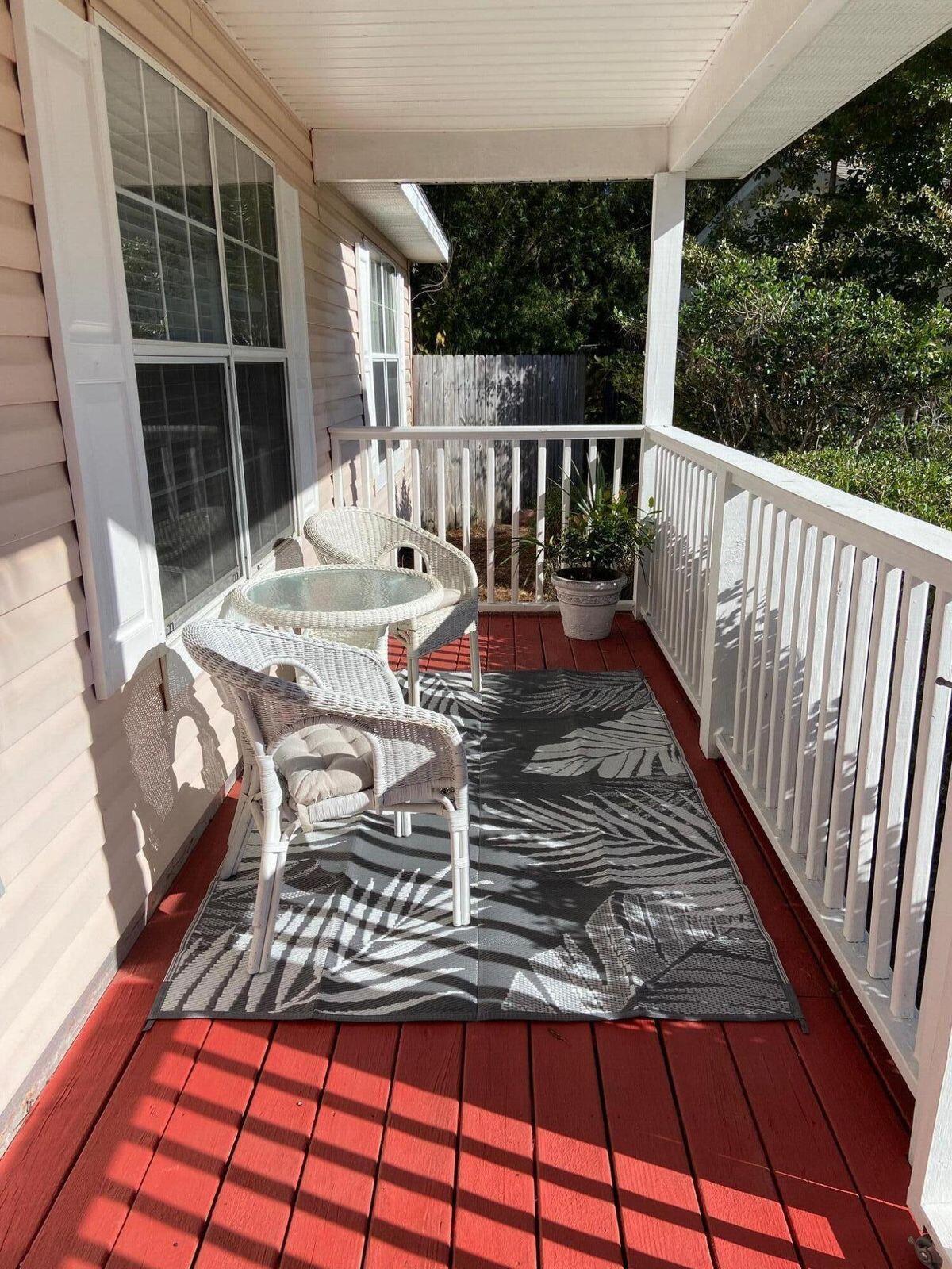 19 Plantation Way Santa Rosa Beach, FL 32459 - Photo 25 of 36 a view of balcony with wooden floor and outdoor seating