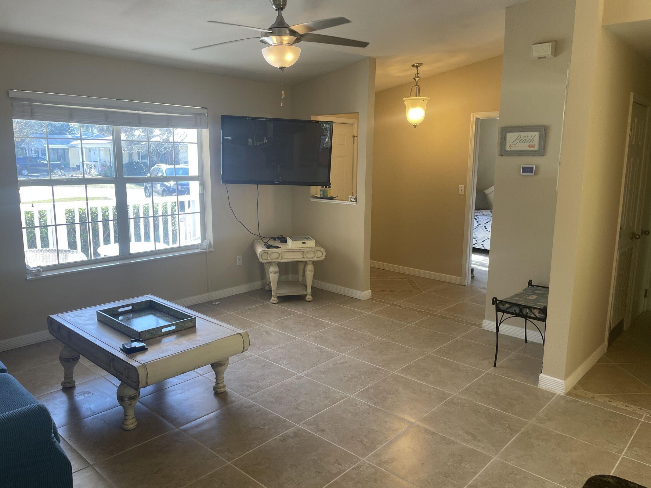 19 Plantation Way Santa Rosa Beach, FL 32459 - Photo 28 of 36 a living room with patio furniture and a window