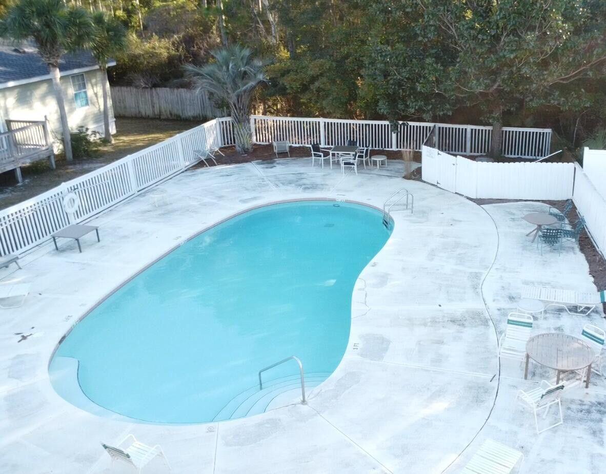 19 Plantation Way Santa Rosa Beach, FL 32459 - Photo 5 of 36 a view of a swimming pool with a patio and couches