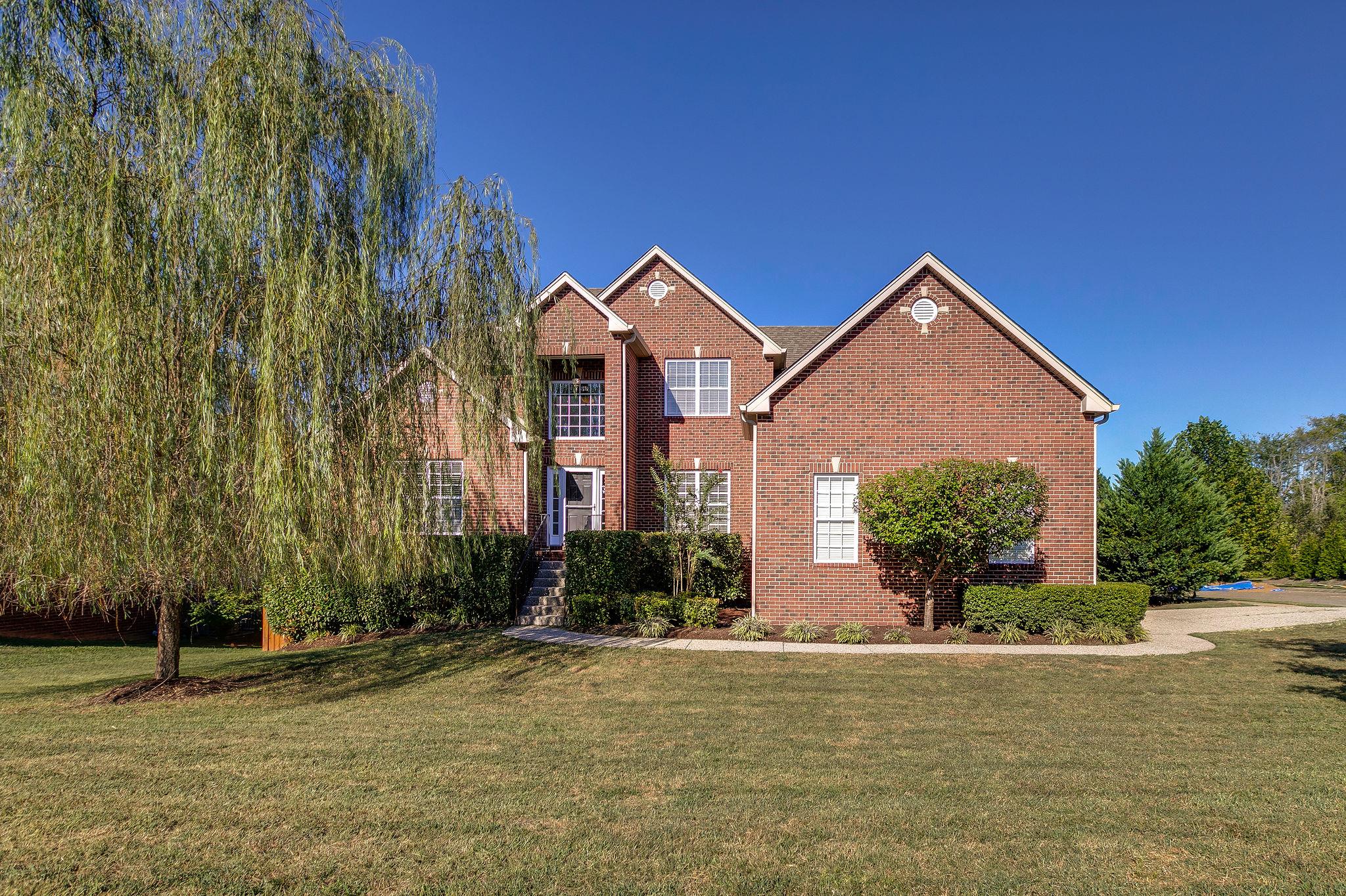 2029 Lincoln Road Spring Hill, TN 37174 - Photo 1 of 30 a front view of a house with a yard